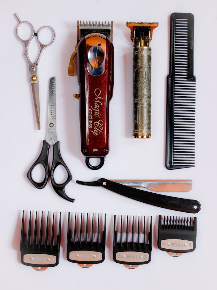 services-01 Collection of essential barber tools for precision haircuts, showcasing scissors, clippers, and combs.